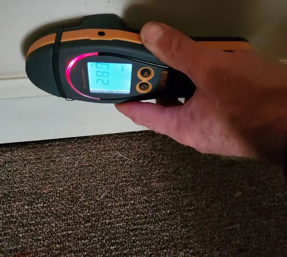 Moisture detection at baseboard during Burst Pipe Cleanup in Derby